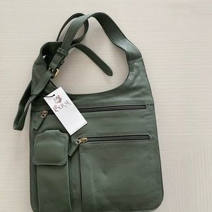 JP Ourse & Cie Leather Travel Bag. Color: Olive